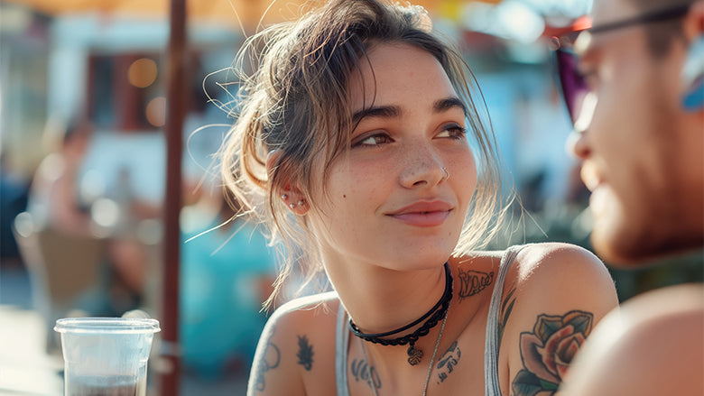 Woman with tattoos in the sun