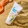 Organic Children Lavender Sun Cream SPF50 tube in the sand