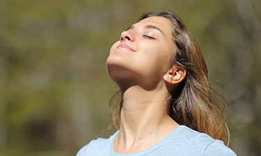 image for anti-ageing spf moisturiser category featuring woman smiling in sunshine