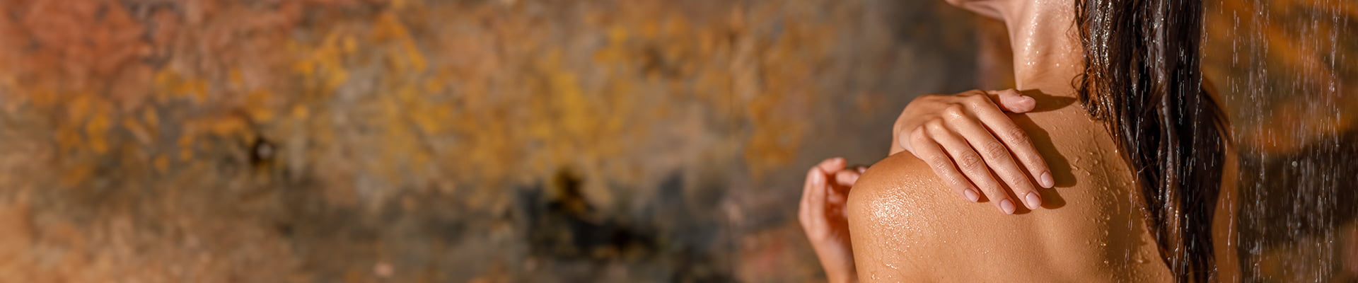 woman washing with fragrance free shower gel