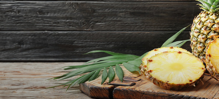 banner for natural face scrub category featuring pineapples