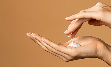 natural hand cream in hands