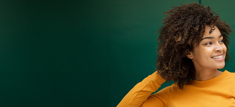 image for sulfate free shampoo category featuring woman with curly hair