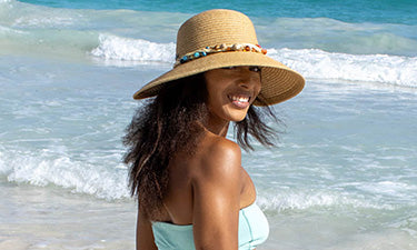 banner for sun cream for prickly heat category featuring woman on beach