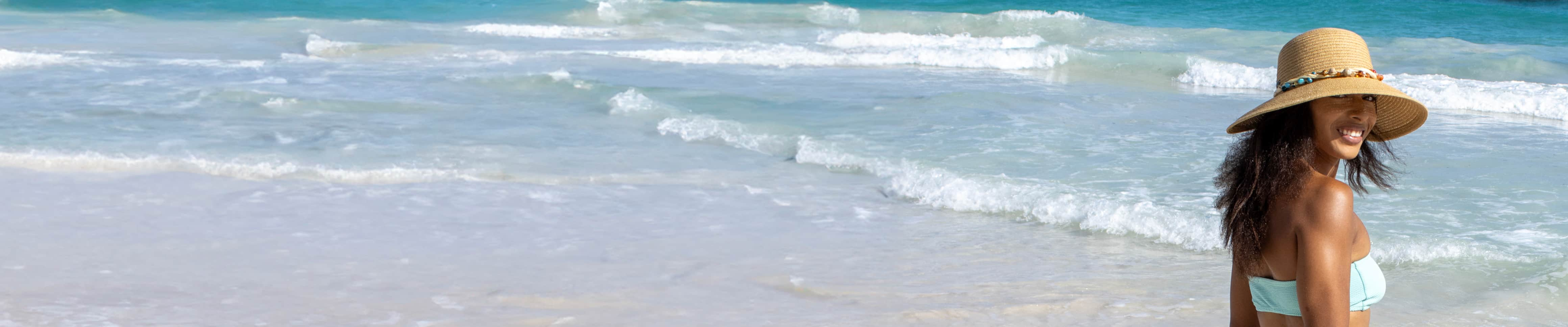 banner for insect repellent category featuring woman smiling on beach