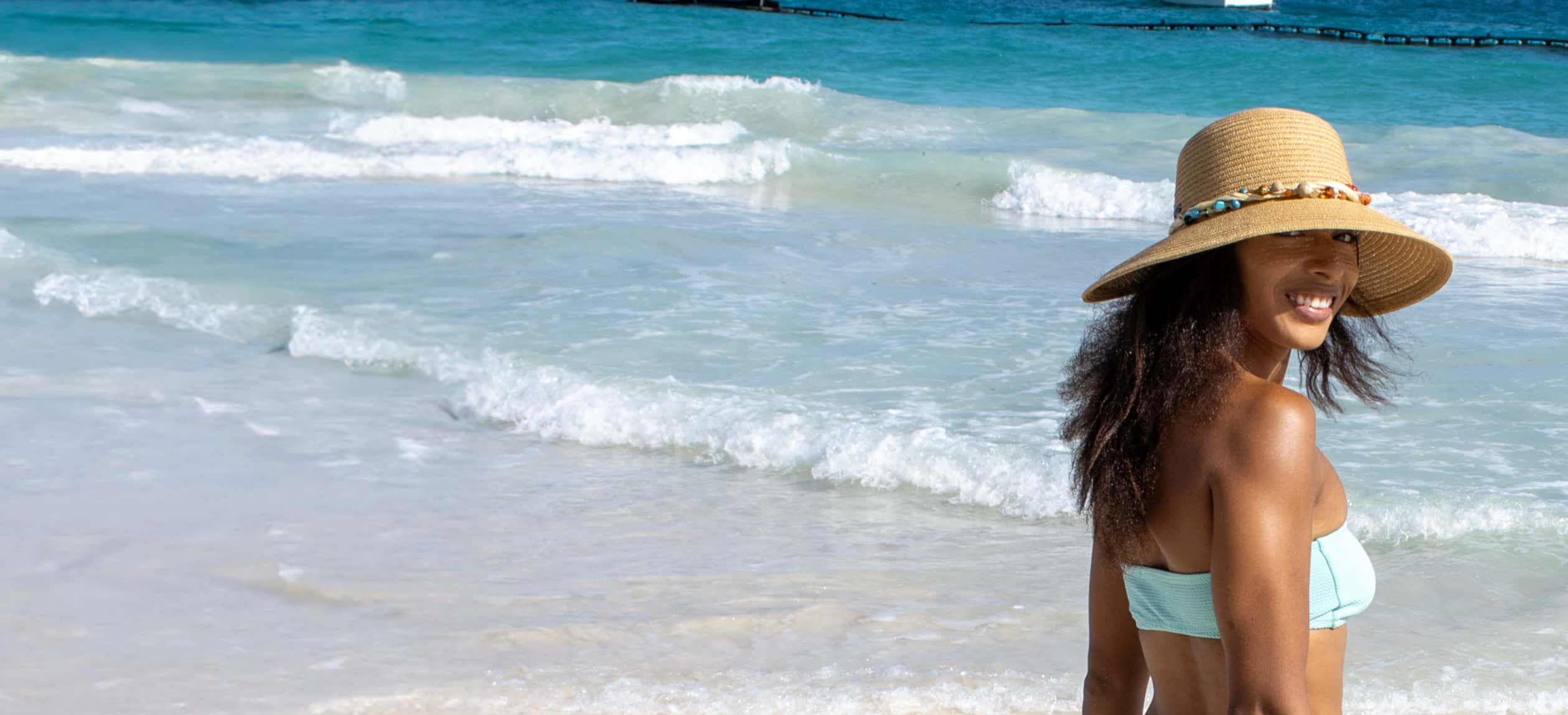 banner for insect repellent category featuring woman smiling on beach